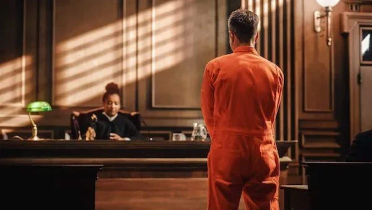 A felon standing in front of a judge. 