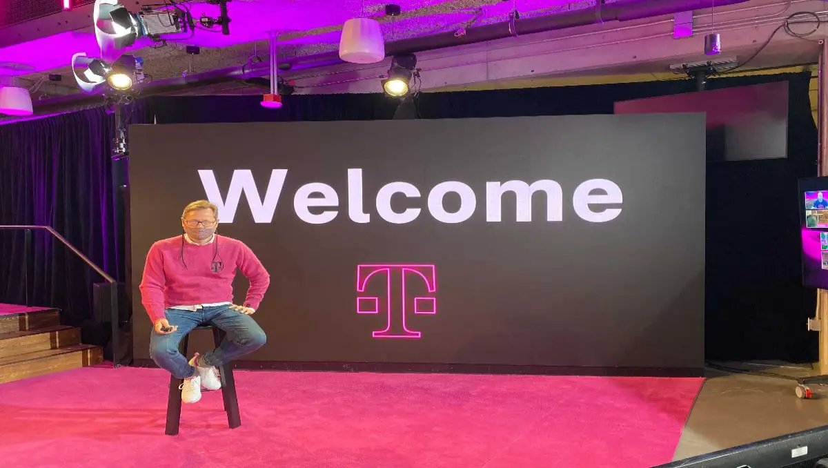 A T-Mobile employee sitting at the stage during the new employee orientation. 